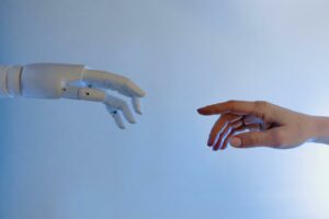 robot and human hands approach to touch